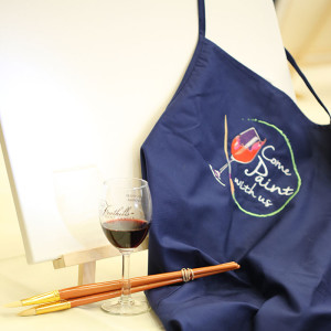Come Paint with Us logo on apron