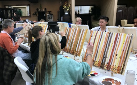 Painters created birch trees at our most recent paint and sip class