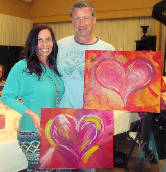 Couple shows off their Valentine Heart paintings