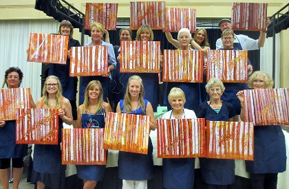 Everyone shows off their paintings